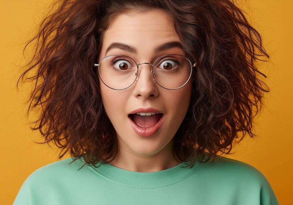 Amazazed girl green shirt mustard background